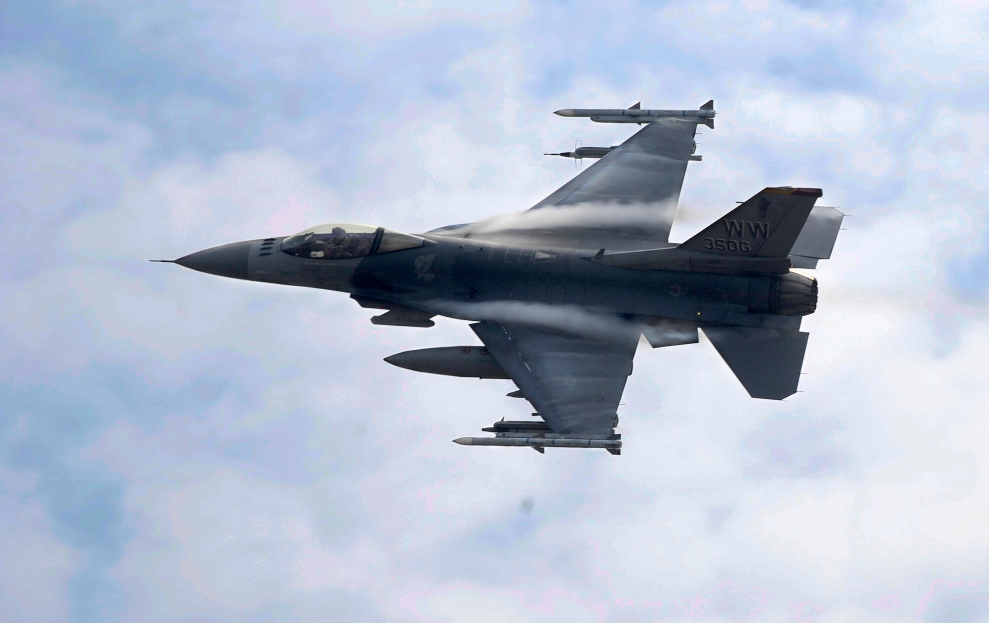 A U.S. Air Force F-16 Fighting Falcon aircraft conduct a simulated Show of Force in support of friendly forces to deter enemy action during the Diesel Weasel Exercise at Draughon Range, Japan, May 8, 2012. During the exercise pilots practiced techniques like strafing targets, allowing them to hone their skills for global contingency operations. (U.S. Air Force photo by Airman 1st Class Kaleb Snay/Released)