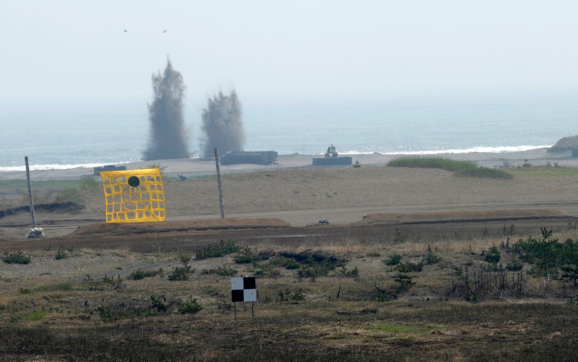 A U.S. Air Force F-16 Fighting Falcon aircraft performs a drop in support of the Diesel Weasel Exercise at Draughon Range, Japan, May 8, 2012. The exercise allows pilots to practice ground-to-air response and provide combat air support. (U.S. Air Force photo by Airman 1st Class Kaleb Snay/Released)