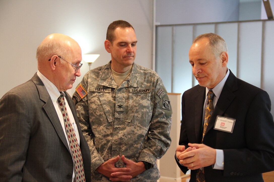 ALEXANDRIA, Va. — Dr. Michael K. Trimble, Veterans Curation Program director (right), talks with Col. Christopher Hall, commander of the U.S. Army Corps of Engineers St. Louis District (center), and another attendee (left) at the open house for the Veterans Curation Project Laboratory here, May 1, 2012. 
The Alexandria laboratory is one of three Veteran Curation Program labs funded and operated by USACE, joining the two labs previously opened in Augusta, Ga., in October 2009 and in St. Louis, Mo., in December 2009. Each site was selected because it is home to high populations of veterans and returning wounded veterans.
