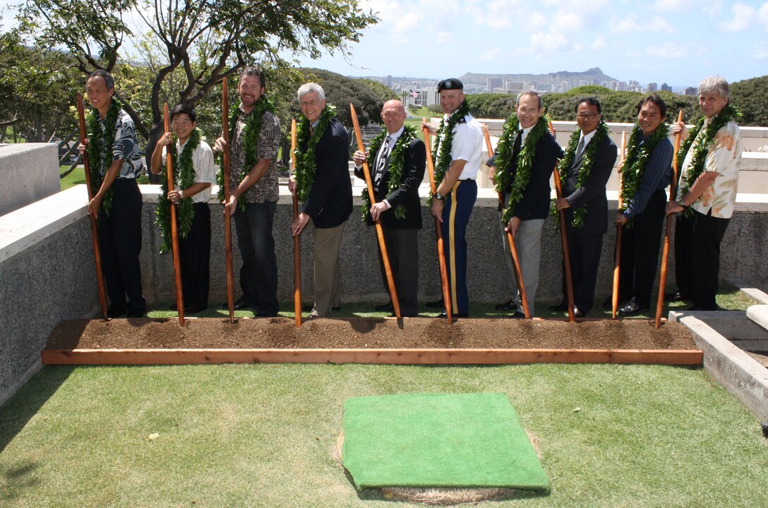 Leaders from the Corps of Engineers joined officials from the Veterans Administration, the American Battle Monuments Commission and others to break ground and bless the new Vietnam Pavilions Project at the National
Memorial Cemetery of the Pacific at Punchbowl on May 9. From left to right: POH Chief, Military Branch, Andrew Kohashi; POH PM Jason Tanaka; Contractor Mike Gangloff; ABMC Chief of Staff,  Michael Conley; Director, National Memorial Cemetery of the Pacific Gene Castagnetti; POH CDR LTC Douglas Guttormsen; ABMC Director, U.S. Memorials, Thomas Sole; President Fung
Associates Louis Fung (architect); Contractor Paul Wong and DLNR Deputy Director William Tam.
