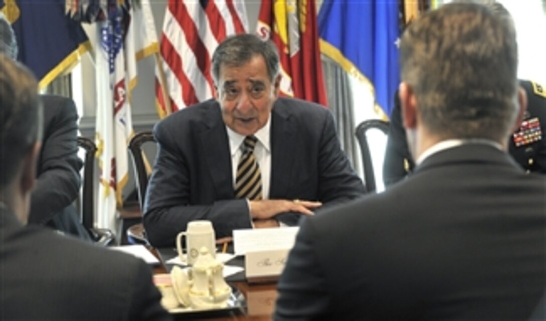Secretary of Defense Leon E. Panetta speaks with Finland's Minister of Defense Stefan Wallin, foreground, as they meet in the Pentagon in Arlington, Va., on May 10, 2012.  Panetta and Wallin are meeting to discuss security issues of interest to both nations