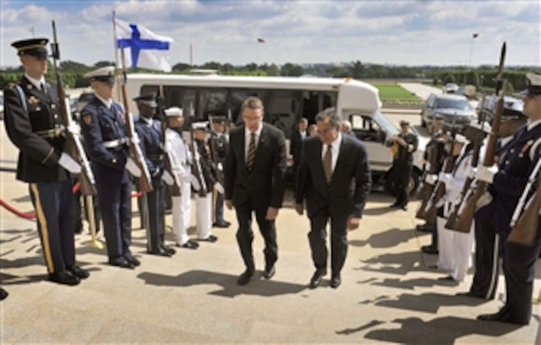 Secretary of Defense Leon E. Panetta, right, escorts Finland's Minister of Defense Stefan Wallin through an honor cordon as he arrives at the Pentagon in Arlington, Va., on May 10, 2012.  Panetta and Wallin will meet to discuss security issues of interest to both nations.  