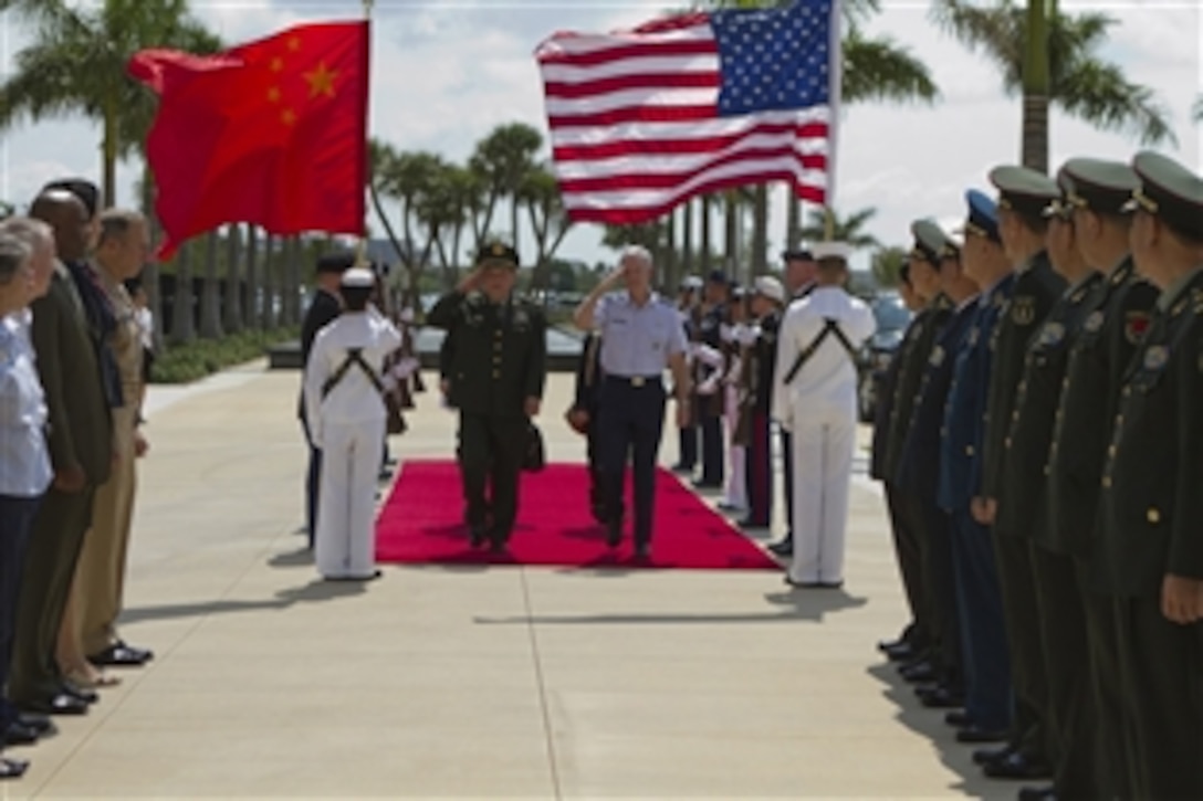 U.S. Air Force Gen. Douglas Fraser, center right, the commander of U.S. Southern Command, hosts an honor cordon to welcome Chinese Minister of National Defense Gen. Liang Guanglie to the command's headquarters in Miami, May 8, 2012. Liang has been visiting U.S. military installations and meeting with U.S. military leaders to discuss U.S.-China cooperation in areas of mutual interest. Liang met with U.S. Defense Secretary Leon E. Panetta at the Pentagon, May 7, 2012. 