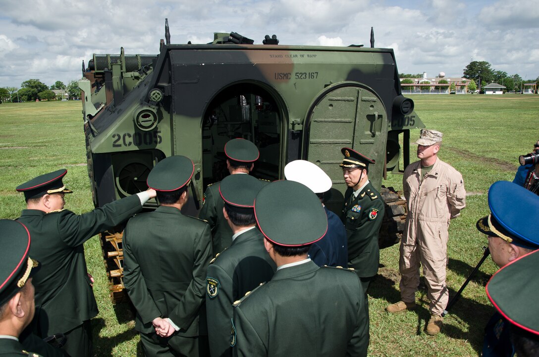 The People’s Republic of China Minister of National Defense Gen. Liang Guanglie is shown the inside of a amphibious assault vehicle by Sgt. Randy Griffith, an amphibious assault vehicle crewman with 2nd Assault Amphibian Battalion, 2nd Marine Division, aboard Marine Corps Base Camp Lejeune, N.C., May 9. During the visit, II MEF Marines showcased several Marine Corps vehicles and equipment sets to highlight the Corps’ emphasis on training and professional development and its capabilities and role in U.S. and global security.   Liang and the rest of the Chinese delegation are in the midst of a tour of several military installations on the East and West Coasts at the invitation of U.S. Secretary of Defense Leon Panetta. The purpose of these visits is to highlight the improvement of the U.S.’s capacity to cooperate in areas of mutual interest, such as humanitarian assistance and disaster relief, and addressing non-traditional and transnational security threats and counter-piracy.