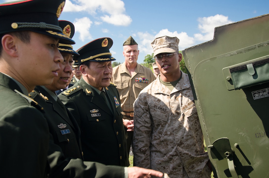 The People’s Republic of China Minister of National Defense Gen. Liang Guanglie is shown the inside of a light armored vehicle by 1st Lt. Abelardo Llamas, commander of 3rd Platoon, Charlie Company, 2nd Light Armored Reconnaissance Battalion, 2nd Marine Division, aboard Marine Corps Base Camp Lejeune, N.C., May 9. During the visit, II MEF Marines showcased several Marine Corps vehicles and equipment sets to highlight the Corps’ emphasis on training and professional development and its capabilities and role in U.S. and global security.   Liang and the rest of the Chinese delegation are in the midst of a tour of several military installations on the East and West Coasts at the invitation of U.S. Secretary of Defense Leon Panetta. The purpose of these visits is to highlight the improvement of the U.S.’s capacity to cooperate in areas of mutual interest, such as humanitarian assistance and disaster relief, and addressing non-traditional and transnational security threats and counter-piracy.