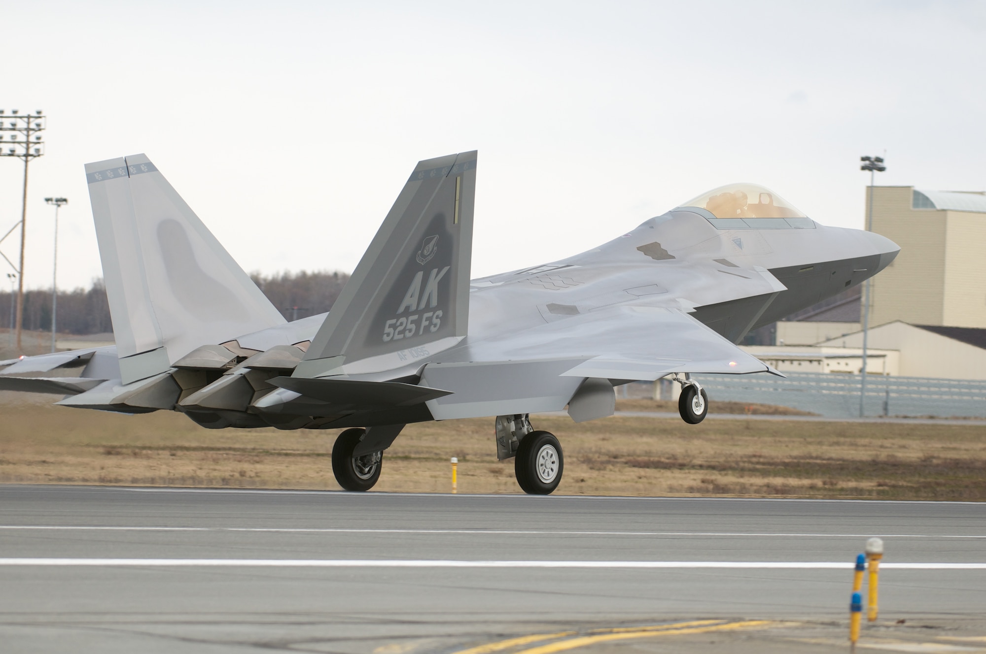 JOINT BASE ELMENDORF-RICHARDSON, Alaska -- The last manufactured F-22 Raptor fighter, flown by Air Force Lt. Col. Paul Moga, 525th Fighter Squadron commander, touches down at the Joint Base Elmendorf-Richardson flightline May 5. (U.S. Air Force photo/David Bedard)