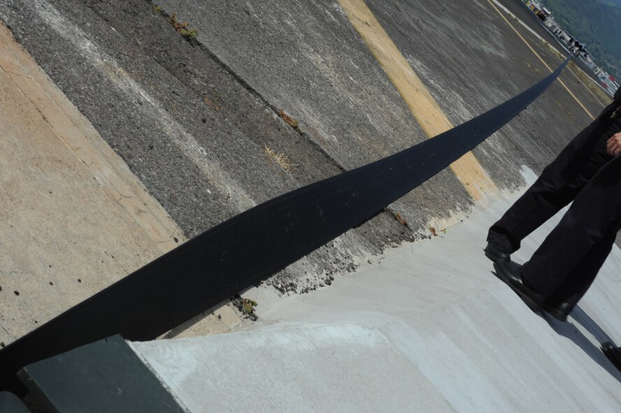 A F-15 Eagle piloted by a member of the Hawaii Air National Guard's 154th Wing tests a BAK-12 aircraft arrest system May 8 at Honolulu International Airport. The three arrest systems here are maintained by the 647th Civil Engineer Squadron and Navy Facilities Engineering Command and are utilized by the deployment of an arresting hook in the rear of the aircraft as a last resort measure when pilots are unable to stop. (U.S. Air Force photo by Staff Sgt. Nathan Allen)