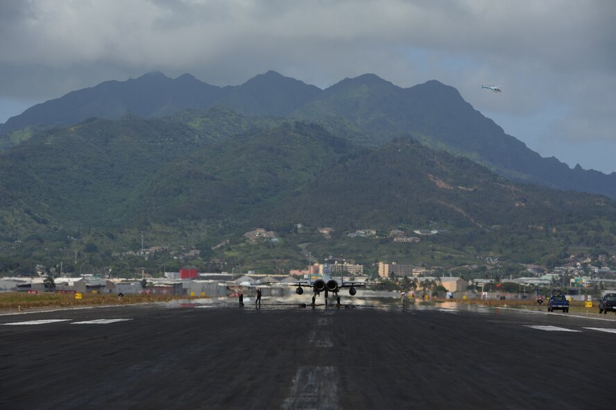A F-15 Eagle piloted by a member of the Hawaii Air National Guard's 154th Wing tests a BAK-12 aircraft arrest system May 8 at Honolulu International Airport. The three arrest systems here are maintained by the 647th Civil Engineer Squadron and Navy Facilities Engineering Command and are utilized by the deployment of an arresting hook in the rear of the aircraft as a last resort measure when pilots are unable to stop. (U.S. Air Force photo by Staff Sgt. Nathan Allen)