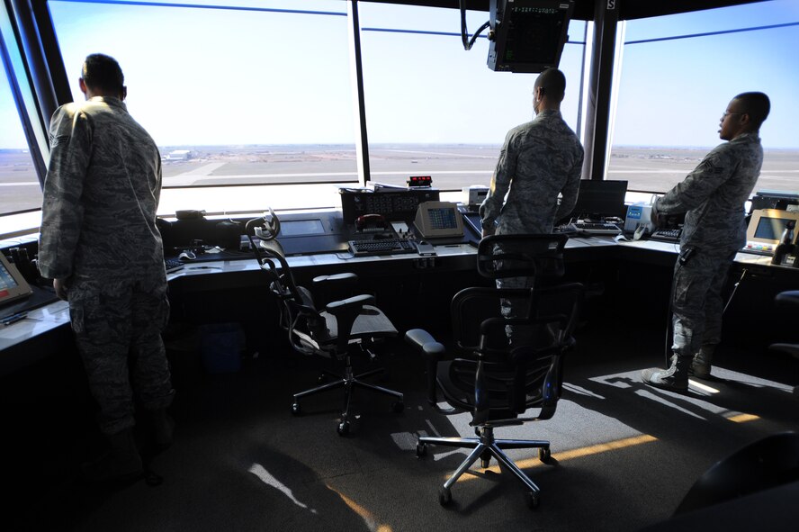 27th Special Operations Support Squadron Air Traffic Control tower controllers observe the flightline at Cannon Air Force Base, N.M., May 9, 2012. Due to the large area of responsibility that air traffic controllers have, their profession is regarded to be one of the most challenging and stressful careers. (U.S. Air Force photo by Airman 1st Class Eboni Reece)