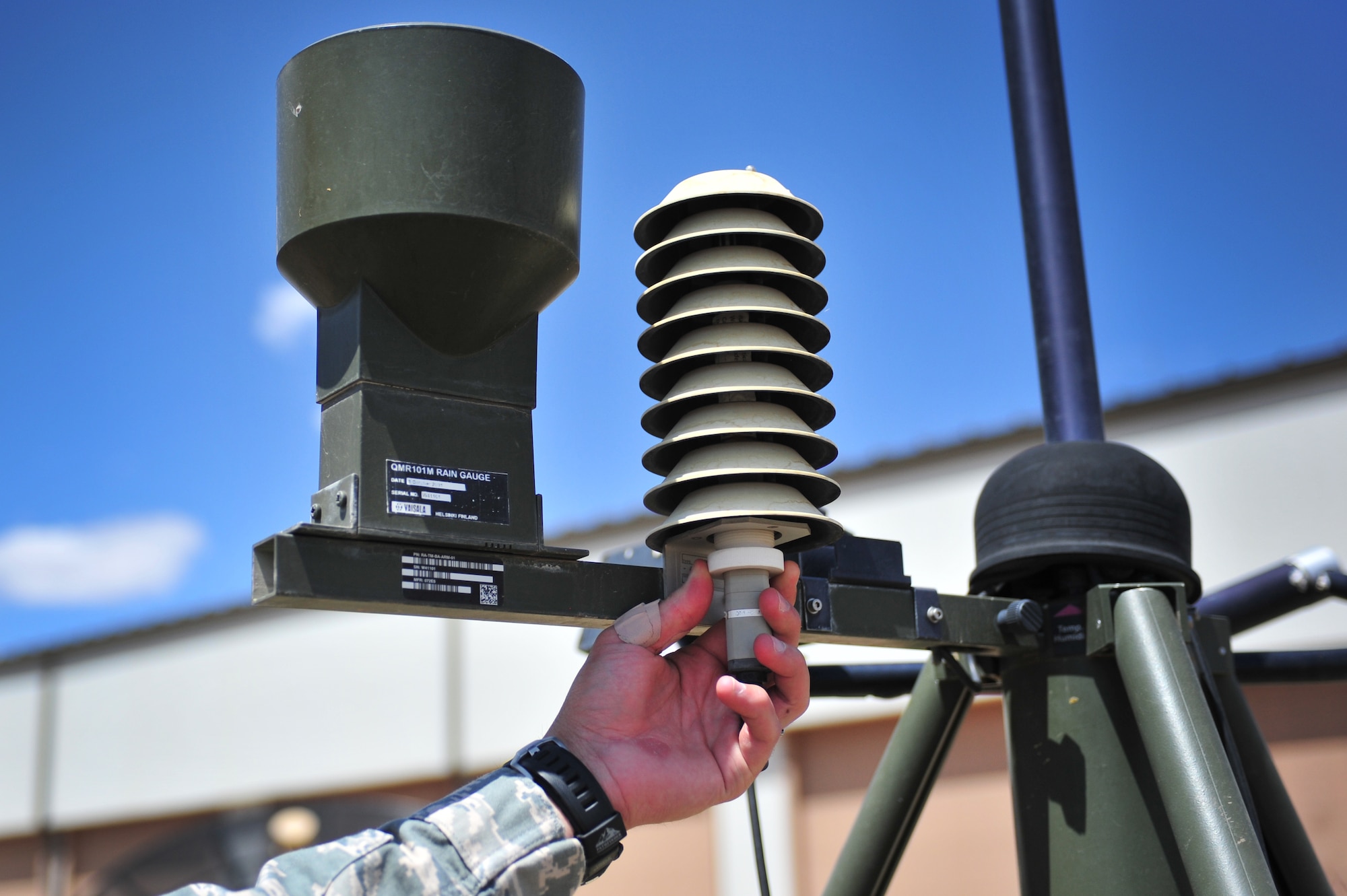 U.S. Air Force Staff Sgt. Phillip Tori, 27th Special Operations Support Squadron weather forecaster, points out a component on an automated tactical observing system that measures humidity in the atmosphere at Cannon Air Force Base, N.M., May 9, 2012. Troops with the weather flight at Cannon are able to gather observational data and post observations within minutes utilizing advanced equipment to aide them in their work. (U.S. Air Force photo by Airman 1st Class Alexxis Pons Abascal)  