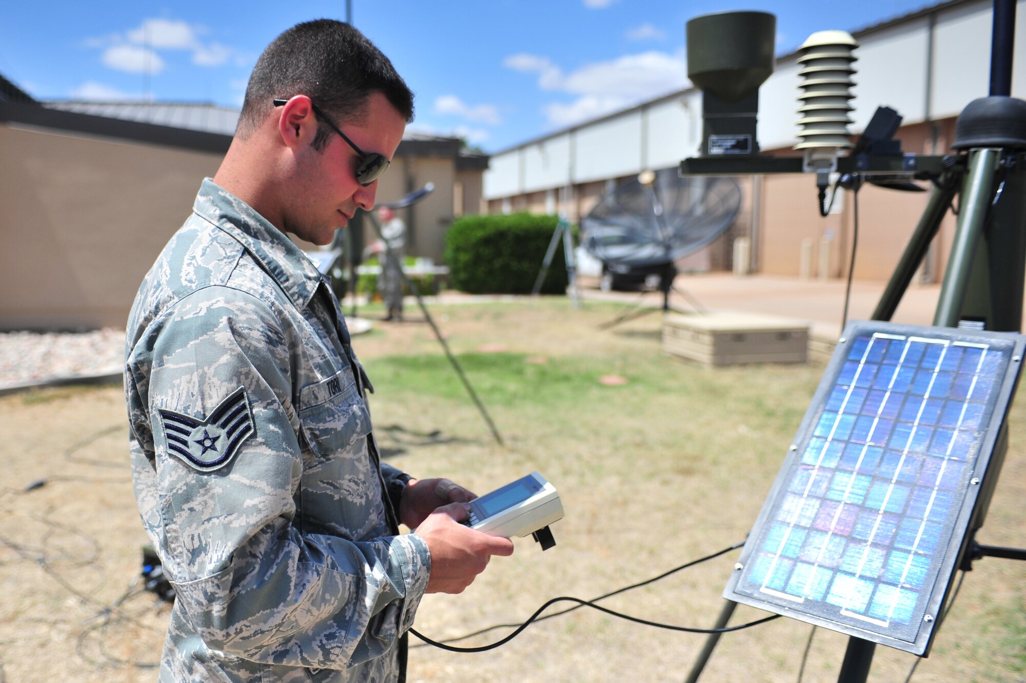U.S. Air Force Staff Sgt. Phillip Tori, 27th Special Operations Support Squadron weather forecaster, gathers data from an automated tactical observing system near the flightline at Cannon Air Force Base, N.M., May 9, 2012. Troops with the weather flight at Cannon are able to gather observational data and post observations within minutes utilizing advanced equipment to aide them in their work. (U.S. Air Force photo by Airman 1st Class Alexxis Pons Abascal)  