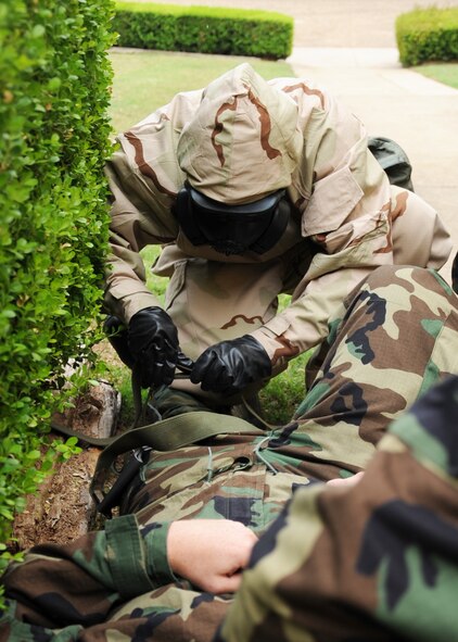 A Barksdale Airman performs self-aid and buddy care during an Ability to Survive and Operate exercise on Barksdale Air Force Base, La., May 11. The ATSO exercise tested Airmen and their ability to respond to various scenarios in a deployed environment. (U.S. Air Force photo/Senior Airman Sean Martin)(RELEASED)