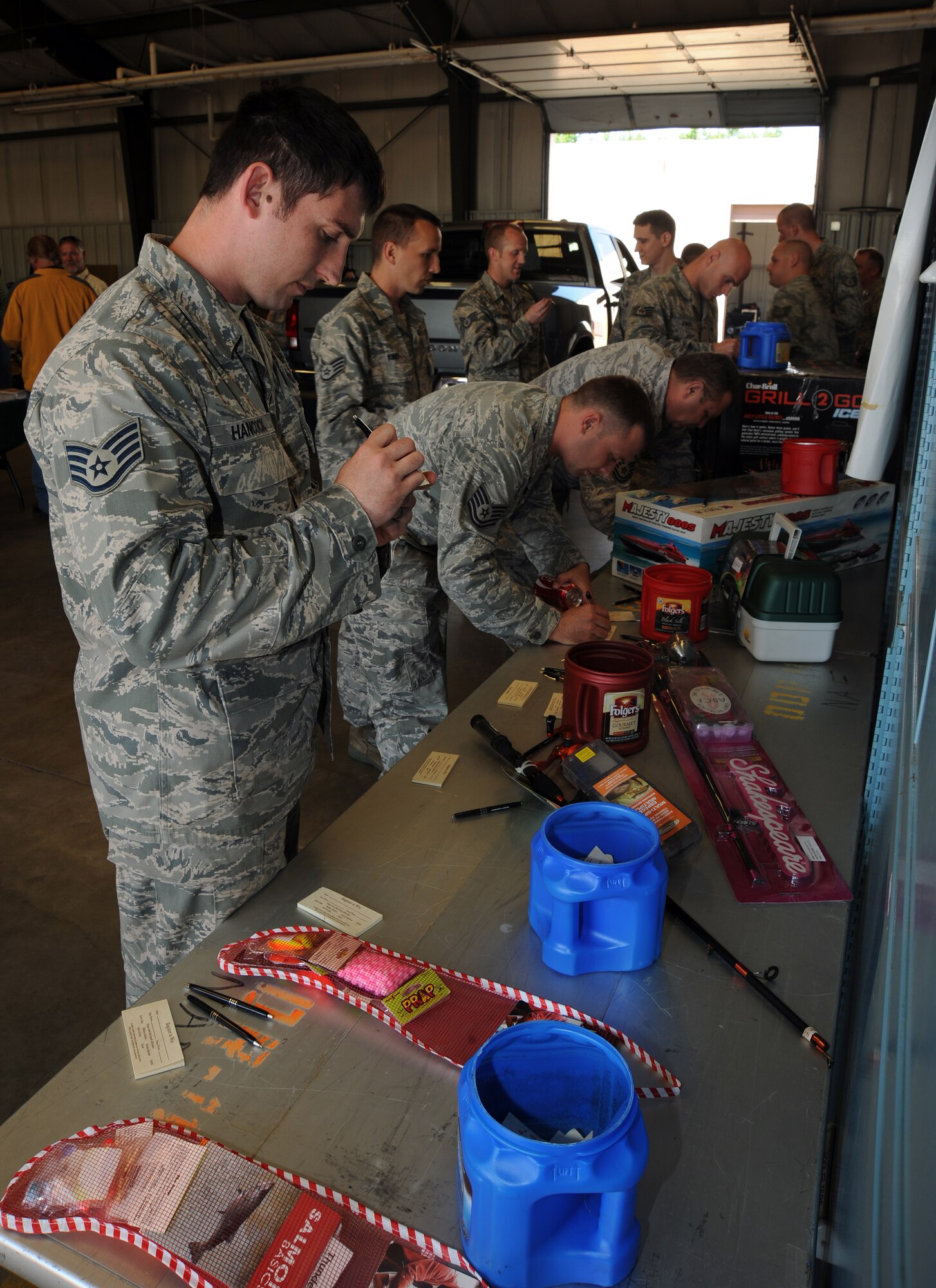 Staff Sgt. Brandon Hancock, 22nd Security Forces vehicle NCO, enters a raffle at the 22nd Force Support Squadron Outdoor Recreation Department open house May 9, 2012, McConnell Air Force Base, Kan. ODR held the open house to showcase their inventory and “Outdoor Recreation on Demand” program. (U.S. Air Force photo/Airman 1st Class Jose L. Leon)
