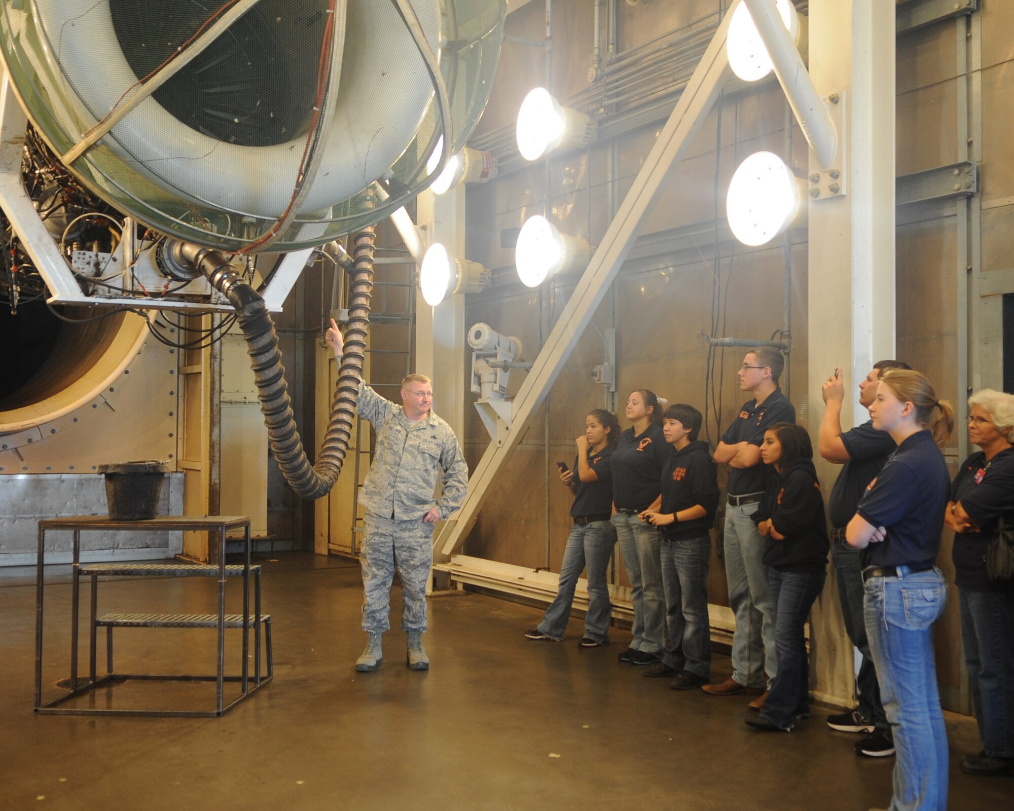 U.S. Air Force Master Sgt. Christopher Sullivan, 7th Component Maintenance Squadron, shows JROTC students from Central High School, San Angelo, Texas, the B-1 Bomber engine in the hush house May 9, 2012, at Dyess Air Force Base, Texas. The students toured different parts of Dyess including the airpark, dorms, hush house and the military working dogs kennel. (U.S. Air Force photo by Airman 1st Class Cierra Bullock/Released)