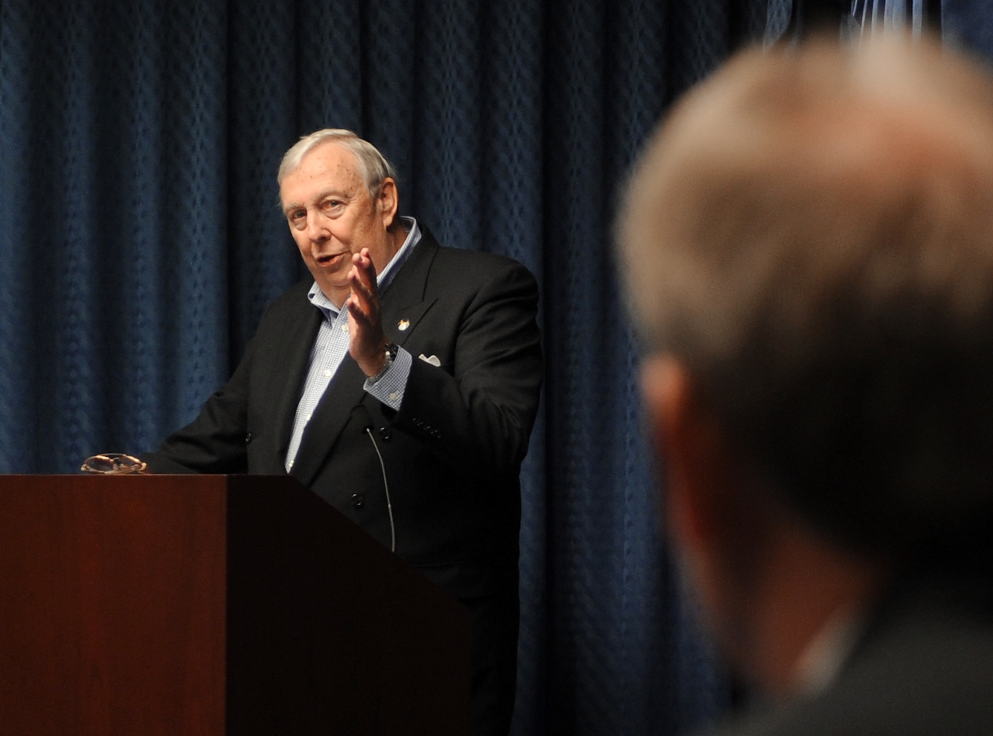 Dr. James G. Roche, former Secretary of the Air Force, speaks to attendees during a ceremony presenting an award that bears his name.  The Dr. James G. Roche Sustainment Excellence award was prented to William Barnes, deputy chief, B-1 systems program office at Tinker Air Force Base, Okla.  (Air Force photo by Andy Morataya)