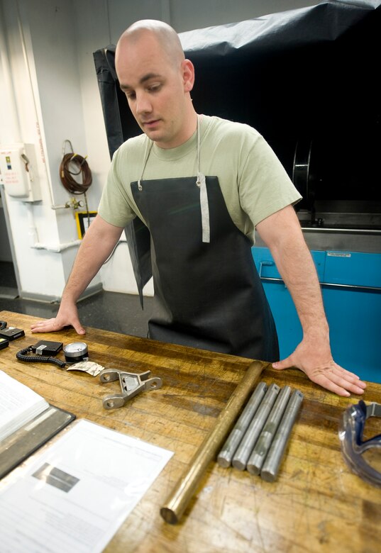 Senior Airman Paul Nessle, 2nd Maintenance Squadron non-destructive inspector, takes inventory of his equipment before conducting a fluorescent magnetic particle test on Barksdale Air Force Base, La., May 9. NDI Airmen use a variety of methods to test the structural integrity of aircraft components without damaging the parts. (U.S. Air Force photo/Staff Sgt. Chad Warren)(RELEASED)