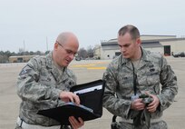 Master Sgt. Robert Fox (left), a production superintendent with the 916th Aircraft Maintenance Squadron, ensures his Airmen know what needs to fixed and when on the KC-135R Stratotanker. Fox gives direction on the ramp during an exercise in March 2012. (USAF photo by Tech. Sgt. Scotty Sweatt, 916ARW/PA, released)