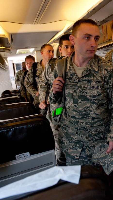 Ellsworth Air Force Base, S.D., Airmen board a commercial aircraft prior to leaving for Green Flag, a training exercise hosted at Nellis Air Force Base, Nev., May 10, 2012. B-1 aircrews and Airmen in a wide variety of career fields are participating in the exercise now through May 24. (U.S. Air Force photo by Airman 1st Class Kate Thornton/Released)