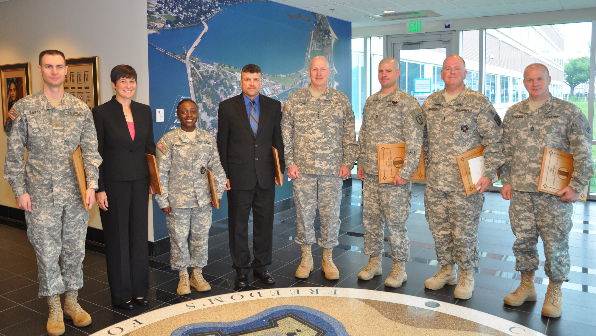 The 2011 U.S. Army Training and Doctrine Command Instructors of the Year stand with Gen. Robert W. Cone, TRADOC commanding general, following the TRADOC Instructors of the Year awards ceremony at the TRADOC Headquarters May 3. From left to right: Maj. Brett Bardo, Officer Instructor of the Year; Erika Brooks, Educator of the Year; Staff Sgt. Adrienne Harmon, Noncommissioned Officer Instructor of the Year; Robert Santos, Civilian Instructor of the Year; Cone; Staff Sgt. Jericho Ingold, National Guard Bureau Instructor of the Year; Chief Warrant Officer 3 Troy Skaggs, Warrant Officer Instructor of the Year; Master Sgt. Jeffrey Kennedy, U.S. Army Reserve Instructor of the Year. (Photo Courtesy of US Army)