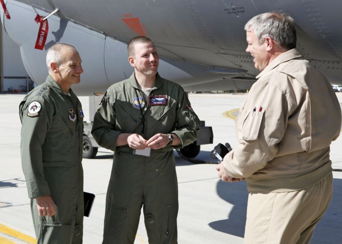 EDWARDS AIR FORCE BASE, Calif. - Commander of Air Force Global Strike Command, Lt. Gen. Jim Kowalski discusses upgrades made to the B-52H test aircraft with Maj. Jonathan Beich and Mr. John Kirk, B-52H Test Radar Navigators at Edwards AFB, Calif., during a recent visit. (U.S. Air Force photo by Jet Fabara)