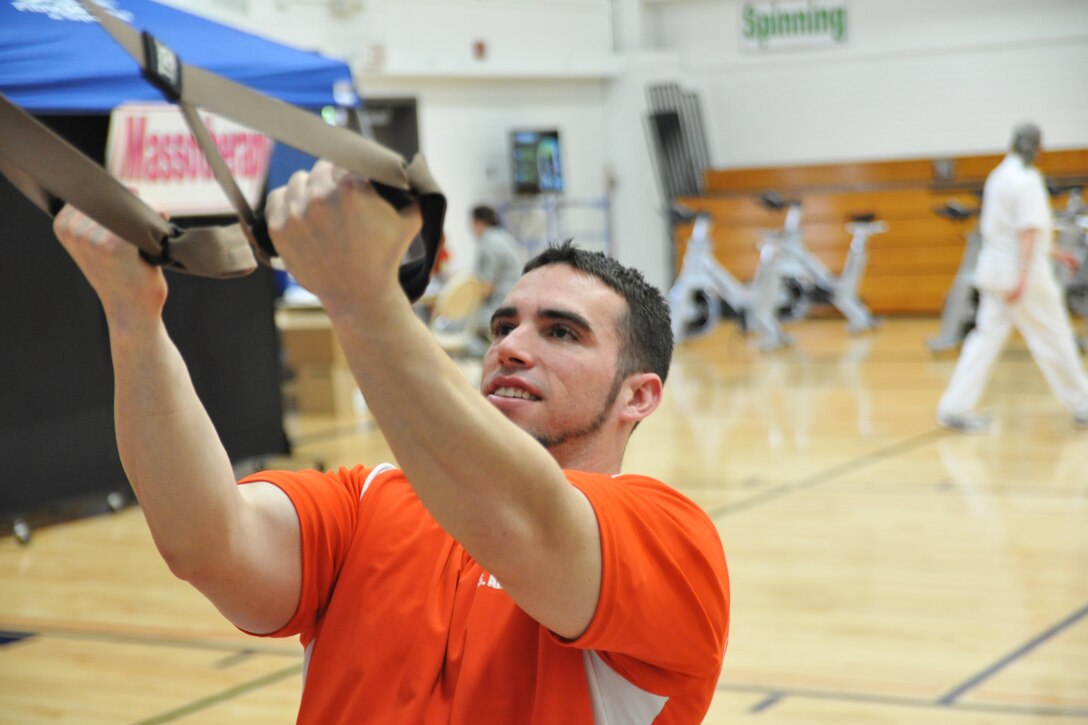 YOUNGSTOWN AIR RESERVE STATION, Ohio – Mr. Luke Christy, Fitness Center recreation assistant, performs TRX (body weight training exercises) during the fifth annual fitness fair May 5, 2012, here. Christy conducts TRX classes every Tuesday and Thursday at the Fitness Center. U.S. Air Force photo by Staff Sgt. Megan Tomkins
