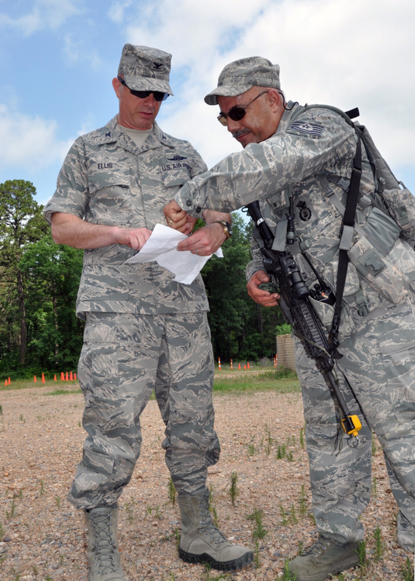 Following the completion of his land navigation training, Tech. Sgt. David Fuselier, 307th Security Forces Squadron, shows his navigation map to Col. Jon Ellis, 307th Bomb Wing commander, during a two-day Bivouac at the Warfare Training Center on Barksdale Air Force Base, La., May 5-6, 2012.  Approximately 50 members of the 307th SFS participated in the IED detection, land navigation and hostile vehicle stop and search training.  (U.S. photo/Master Sgt. Mary Hinson)