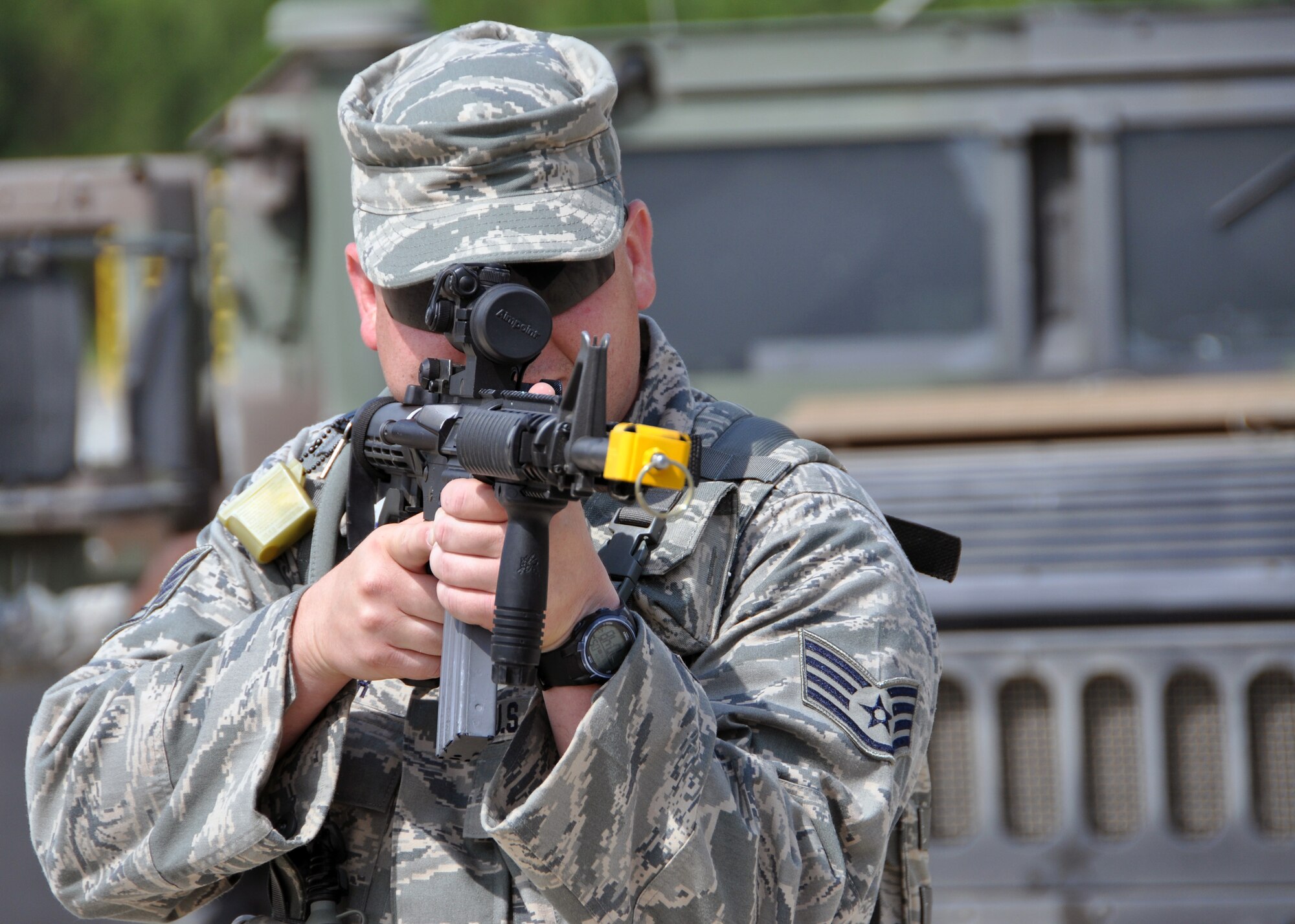 Staff Sgt. James Cosper, 307th Security Forces Squadron, approaches to search a suspicious vehicle as part of the Bivouac held May 5-6, 2012, at the Warfare Training Center on Barksdale Air Force Base, La.  Exercises included land navigation, improvised explosive device (IED) detection and hostile vehicle stops and searches. (U.S. Air Force photo/Master Sgt. Mary Hinson)