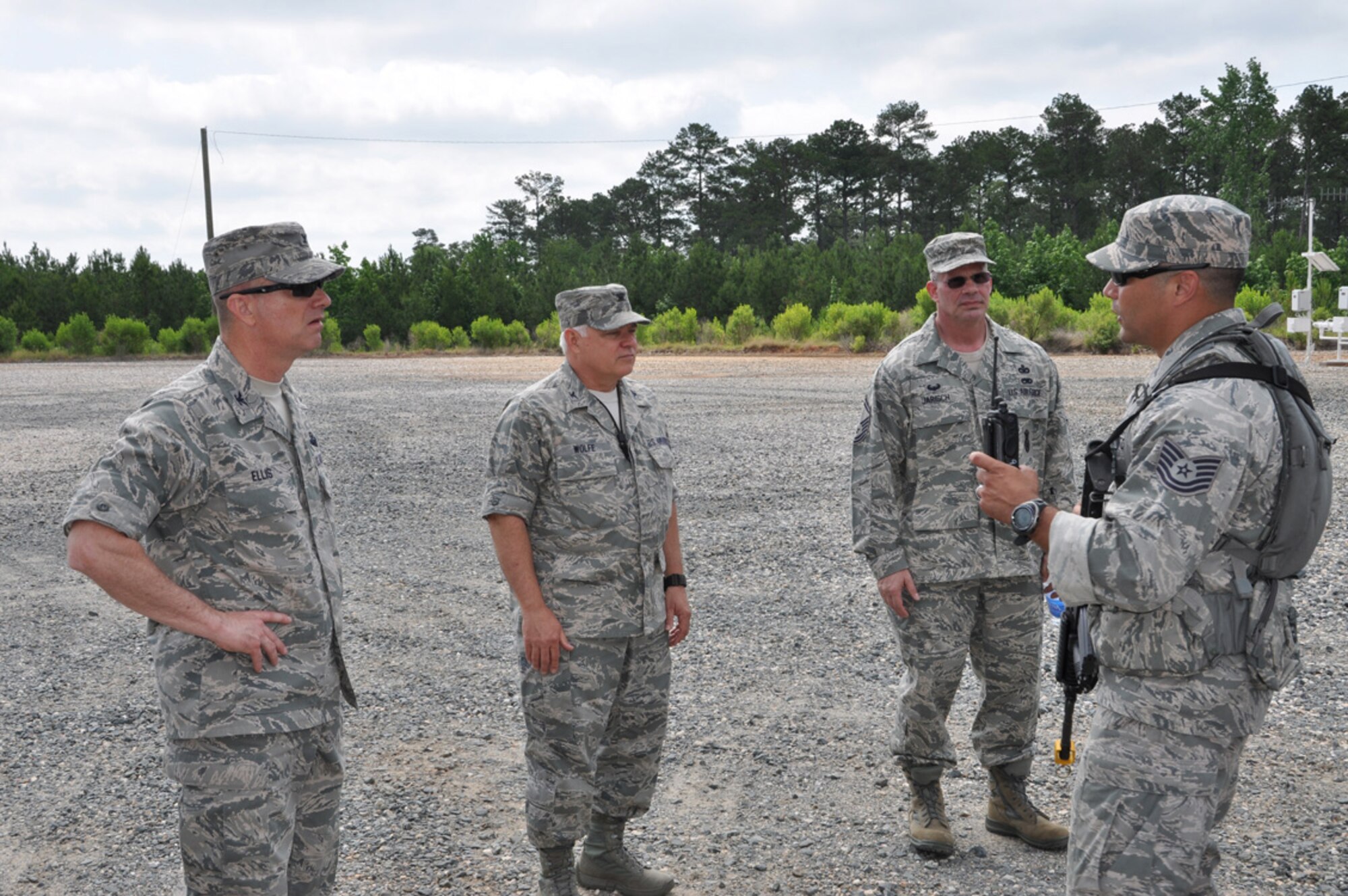 Col. Jon Ellis, 307th Bomb Wing commander (far left), Col. Kevin Wolfe, 307th Mission Support Group commander, and Senior Master Sgt. Paul Jarisch, 307th Security Forces Squadron, listen as Tech. Sgt. Daniel Zamora, 307th SFS, explains the details of the next exercise in the Bivouac May 5, 2012, at Barksdale Air Force Base, La.  Approximately 50 members of the 307th Security Forces spent two days training on land navigation, improvised explosive device (IED) detection and hostile vehicle stops and searches.  (U.S. photo/Master Sgt. Mary Hinson)