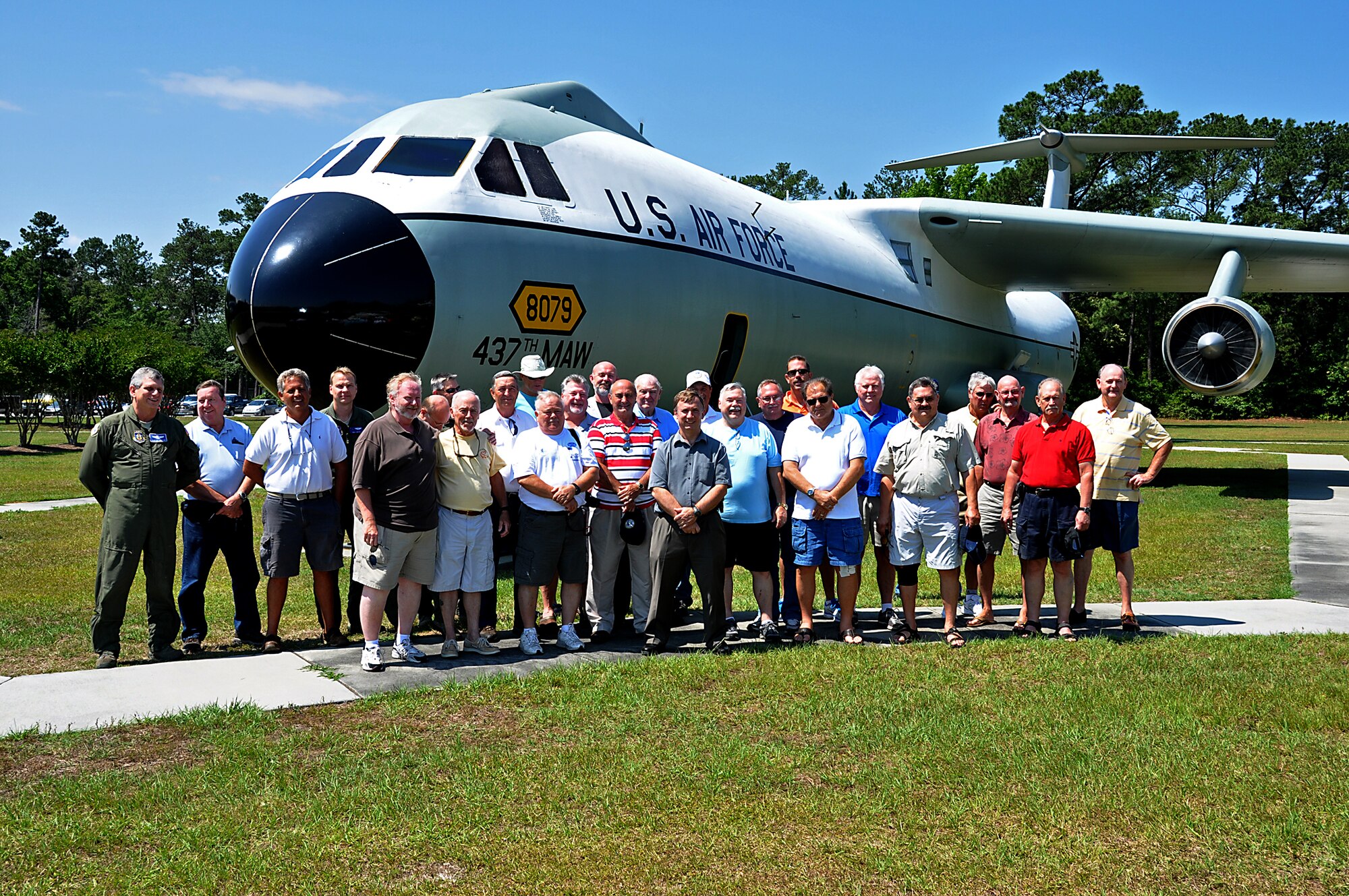 Former C-141 Starlifter 701st Airlift Squadron aircrew members pose for a photograph in front of their favorite aircraft at the Joint Base Charleston, S.C. Heritage air park May 11, 2012 . The crew, which  included several still active members flew the Starlifter during 70, 80 and 90s, were given access inside the historic static display where they showed their friends and families what the aircraft was like.  (U.S. Air Force Photo by Michael Dukes)