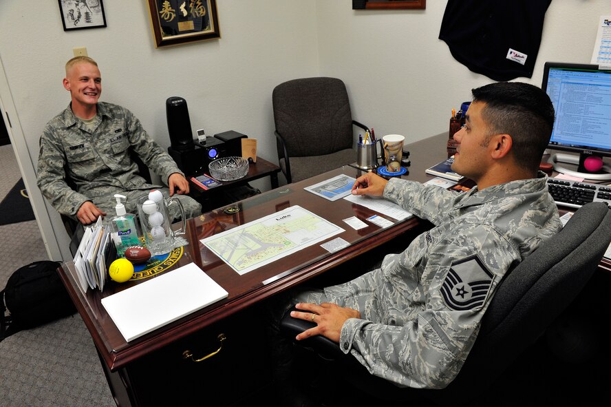 Senior Airman Brandon Kringen, 756th Aircraft Maintenance Squadron assistant dedicated crew chief, speaks to Master Sgt. José Nuñez, 756th AMXS, 310th Aircraft MaintenanceUnit first sergeant, during a mentoring session May 1 at Luke Air Force Base.  (U.S. Air Force photo by Staff Sgt. Jason Colbert)