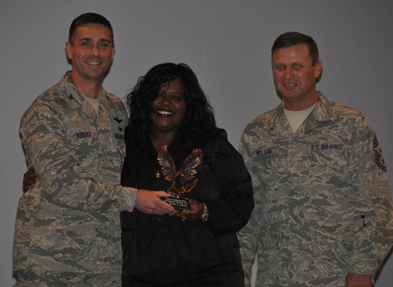 While Ms. Lisa Jokines (center) isn't new to the 916th Air Refueling Wing, she did win the 2011 Junior Civilian of the Year award recently. Congrats Ms. Lisa! (USAF photo by Maj. Shannon Mann, 916ARW/PA, released)