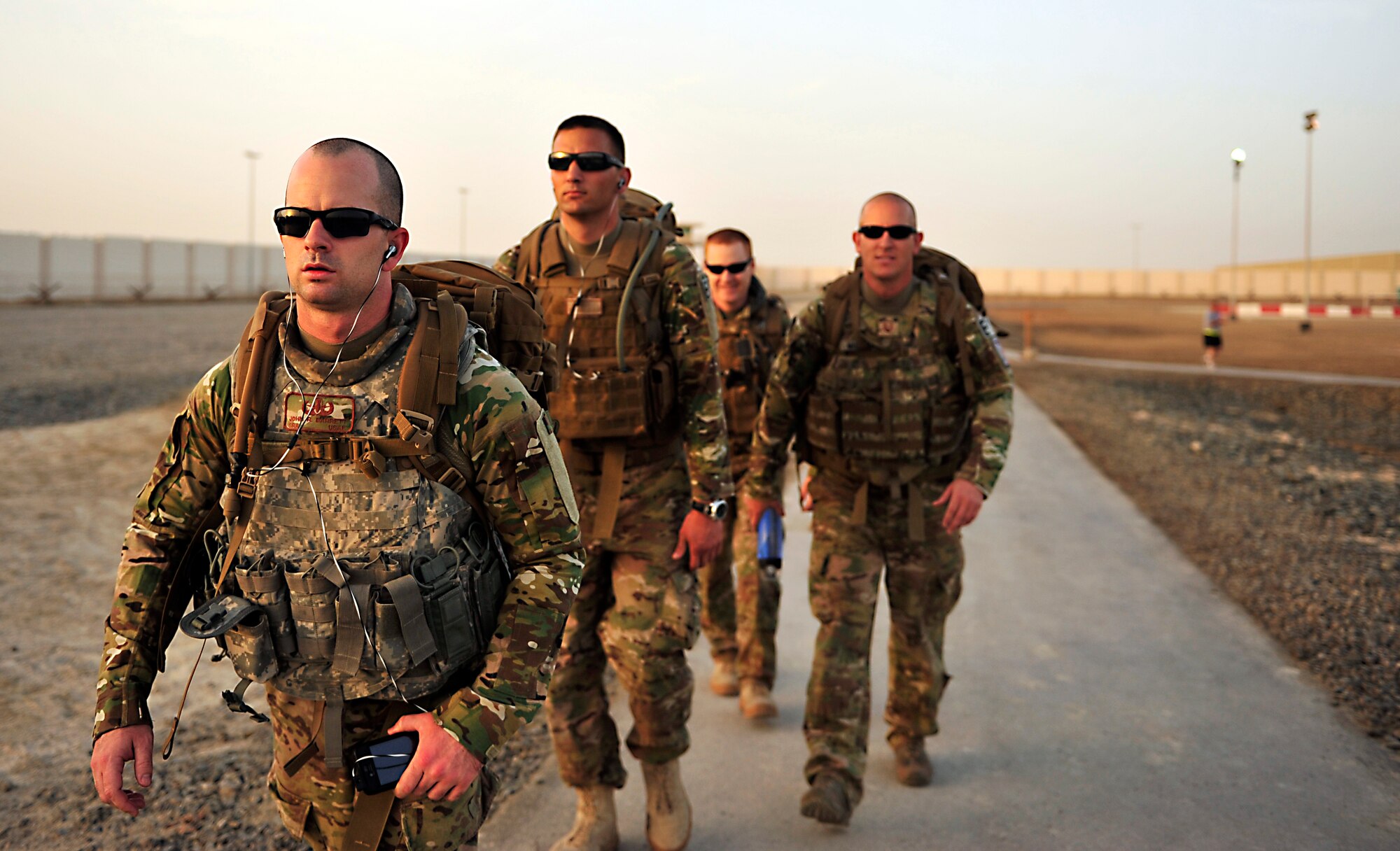 SOUTHWEST ASIA-Explosive ordnance disposal technicians from the 380th Expeditionary Civil Engineer Squadron complete a three-mile ruck march May 8, 2012. For the ruck march, the Airmen carried a rucksack weighing about 50 pounds in addition to their full uniform and body armor while walking through challenging terrain. The EOD flight uses ruck marches and other unique training in order to stay in top physical shape. (U.S. Air Force photo/Staff Sgt. Sara Csurilla)