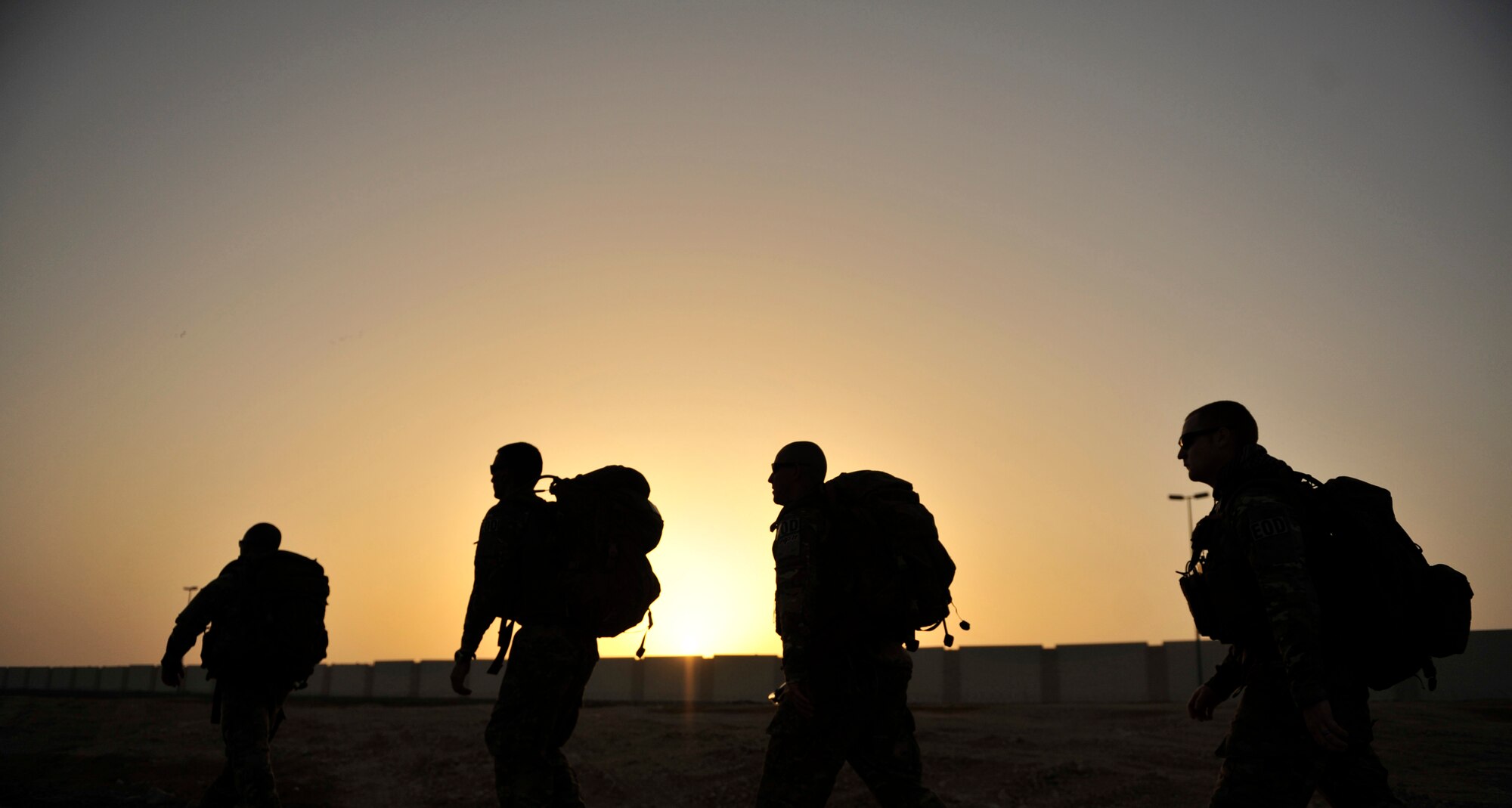 SOUTHWEST ASIA-Explosive ordnance disposal technicians from the 380th Expeditionary Civil Engineer Squadron complete a three-mile ruck march May 8, 2012. For the ruck march, the Airmen carried a rucksack weighing about 50 pounds in addition to their full uniform and body armor while walking through challenging terrain. The EOD flight uses ruck marches and other unique training in order to stay in top physical shape. (U.S. Air Force photo/Staff Sgt. Sara Csurilla)