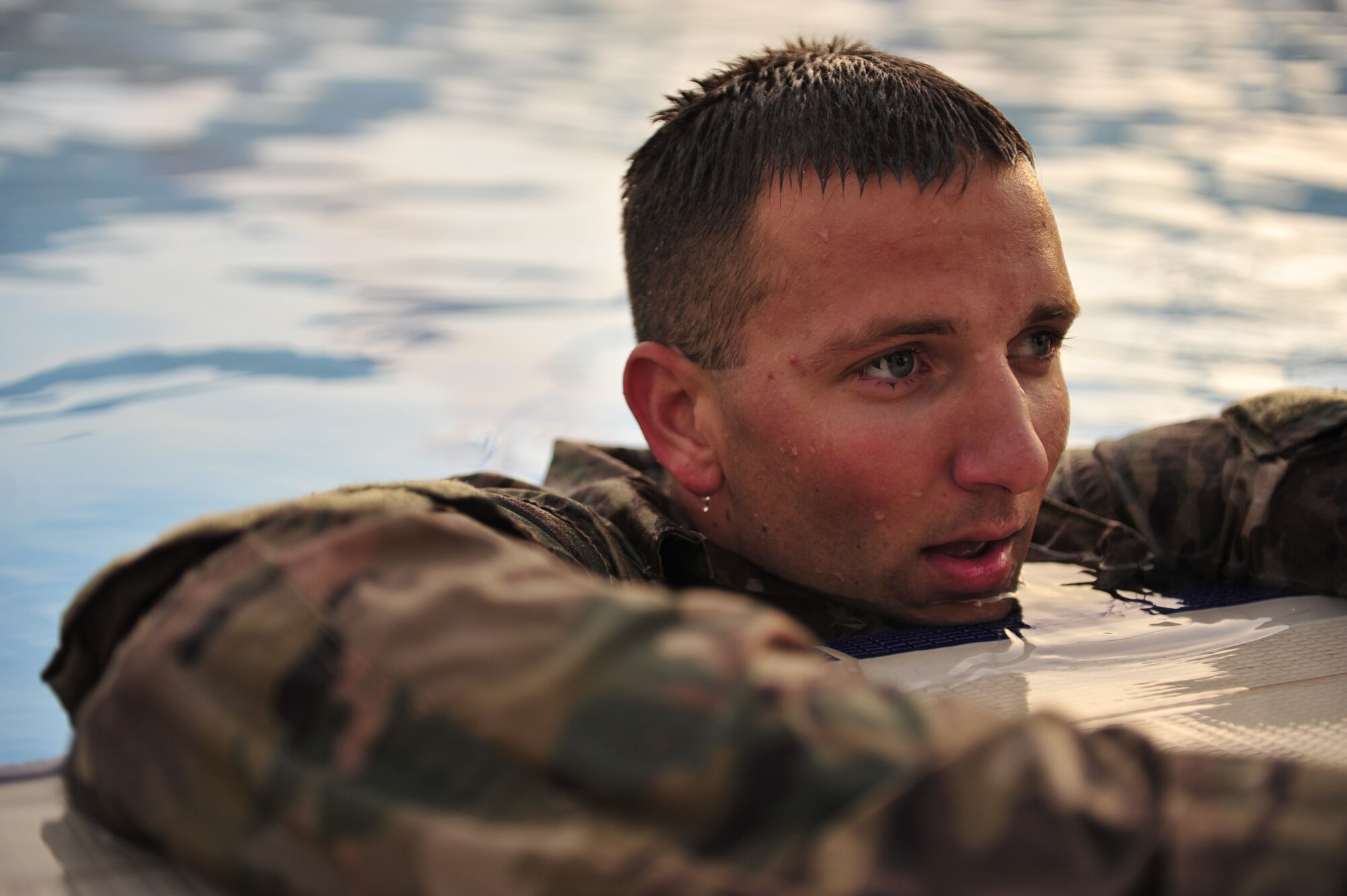 SOUTHWEST ASIA-U.S. Air Force Staff Sgt. Dustin Ballard, 380th Expeditionary Civil Engineer Squadron dxplosive ordnance disposal technician, rests during water training in Southwest Asia May 3, 2012. Members of the EOD flight use water training as part of their physical training routine to stay in top physical condition. (U.S. Air Force photo/Staff Sgt. Sara Csurilla)
