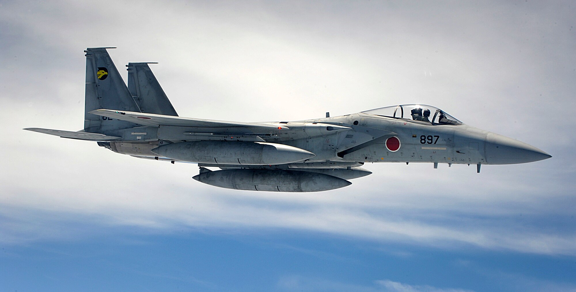 A Japanese Air Self Defense Force F-15 Eagle flies alongside a U.S. Air Force KC-135 Stratotanker while waiting to refuel near Okinawa, Japan, May 10, 2012. The bilateral training with JASDF aims to improve interoperability between U.S. and Japanese air forces. (U.S. Air Force photo/Airman 1st Class Brooke P. Beers)