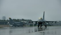 An F-16 Fighting Falcon aircraft from the 14th Fighter Squadron taxis to the runway during the Diesel Weasel Exercise at Misawa Air Base, Japan, May 10, 2012.  When supporting an air-to-surface role, the F-16 can fly more than 500 miles, deliver its weapons with superior accuracy, defend against enemy aircraft and return to its starting point. (U.S. Air Force photo by Staff Sgt. Nathan Lipscomb/Released)
