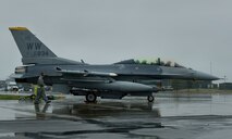 U.S. Air Force Airman 1st Class Robert Wickman, 35th Aircraft Maintenance Squadron crew chief, inspects an F-16 Fighting Falcon aircraft during the Diesel Weasel Exercise at Misawa Air Base, Japan, May 10, 2012. Wickman serves as the pilot's eyes and ears outside the aircraft during engine startup and pre-flight operational checks. (U.S. Air Force photo by Staff Sgt. Nathan Lipscomb/Released)