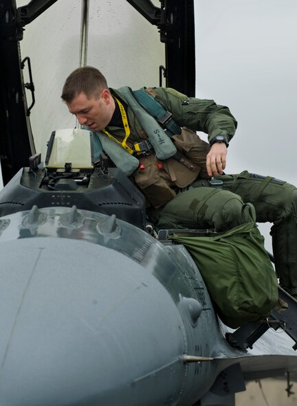 U.S. Air Force Capt. Jason Schaub, 14th Fighter Squadron pilot, climbs into the cockpit of an F-16 Fighting Falcon during the Diesel Weasel Exercise at Misawa Air Base, Japan, May 10, 2012. The Diesel Weasel Exercise tests pilots’ ability to provide close air support during realistic exercise scenarios. (U.S. Air Force photo/Staff Sgt. Nathan Lipscomb/Released) 
