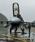 U.S. Air Force Airman 1st Class Robert Wickman, 35th Aircraft Maintenance Squadron crew chief, removes the seat covers from an F-16 Fighting Falcon while Capt. Jason Schaub, 14th Fighter Squadron pilot, completes a pre-flight checklist during the Diesel Weasel Exercise at Misawa Air Base, Japan, May 10, 2012. F-16 Fighting Falcon aircrafts can locate targets in all weather conditions and detect low flying aircraft in radar ground clutter.  (U.S. Air Force photo by Staff Sgt. Nathan Lipscomb/Released)