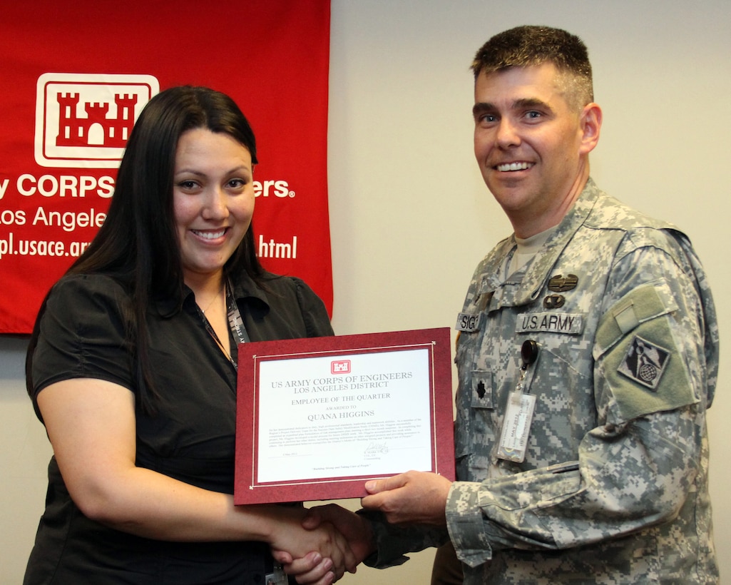 Quana Higgins, a lead planner in the U.S. Army Corps of Engineers Los Angeles District, receives the first Kevin Inada Employee of the Quarter award from Deputy Commander Lt. Col. Steven Sigloch during a ceremony held at the District headquarters May 4.