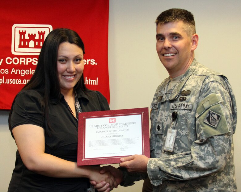 Quana Higgins, a lead planner in the U.S. Army Corps of Engineers Los Angeles District, receives the first Kevin Inada Employee of the Quarter award from Deputy Commander Lt. Col. Steven Sigloch during a ceremony held at the District headquarters May 4.