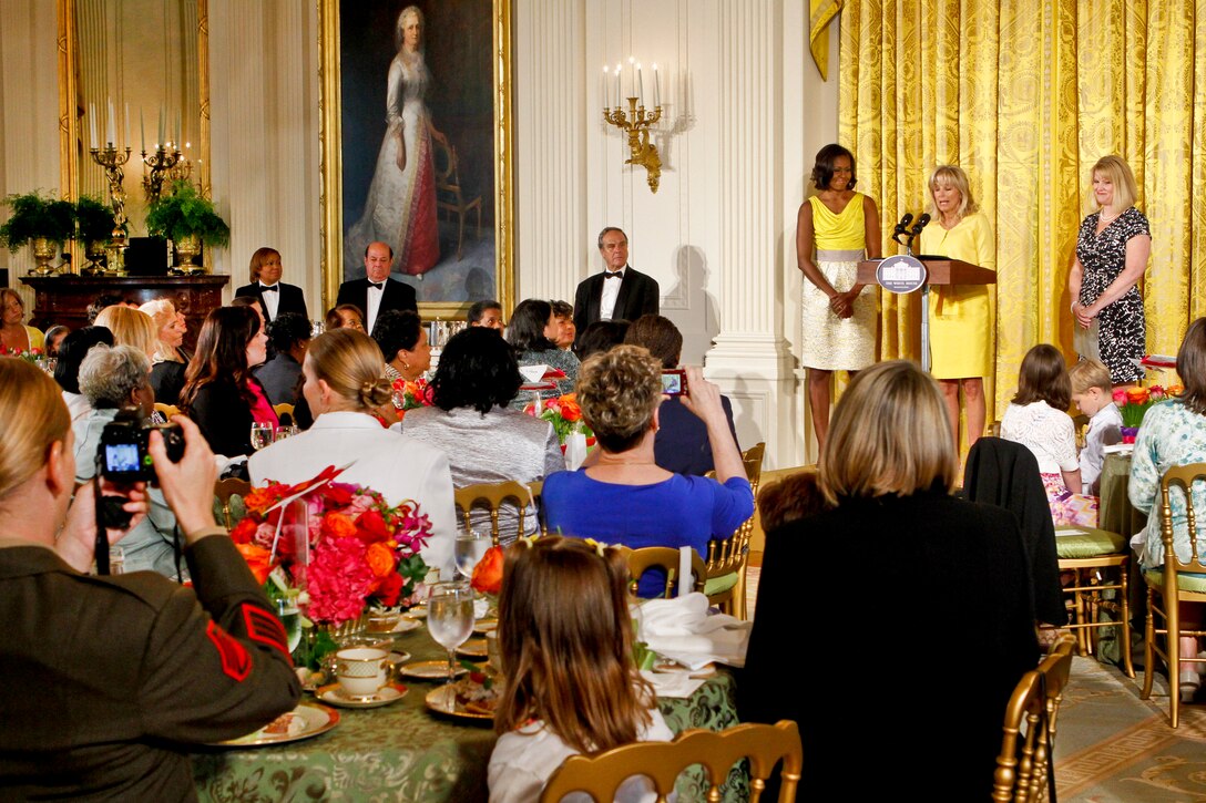 First Lady Michelle Obama, left, Jennifer Pilcher, a Navy spouse and Dr. Jill Biden, wife of Vice President Joe Biden, celebrate three generations of military families during a Joining Forces Mother's Day event at the White House in Washington, D.C., May 10, 2012.