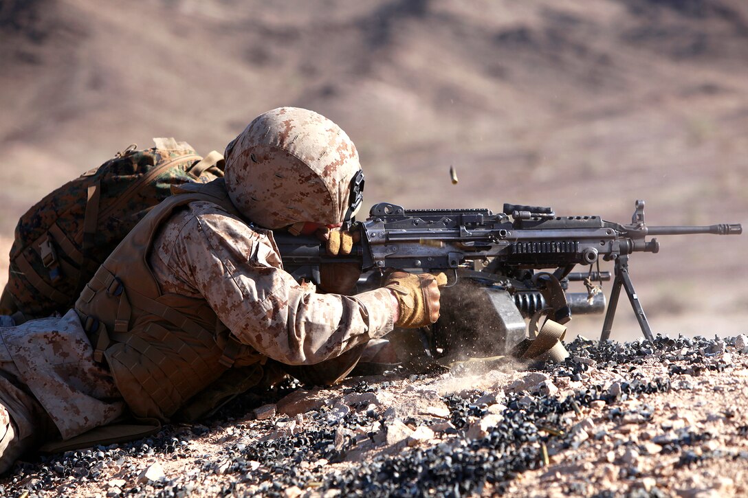 A Marine with the Support by Fire Team, Tactical Recovery of Aircraft and Personnel Platoon, 15th Marine Expeditionary Unit, provides suppressive fire, in the Chocolate Mountains, Calif., May 11. The training scenario involved his platoon recovering personnel from a tactical air control party, after they reported contact from a notional local enemy attack force. The training was conducted to increase the competency of the TRAP force and as a part of the ground portion of Realistic Urban Training, which the 15th MEU is conducting in preparation for their deployment scheduled for this fall.