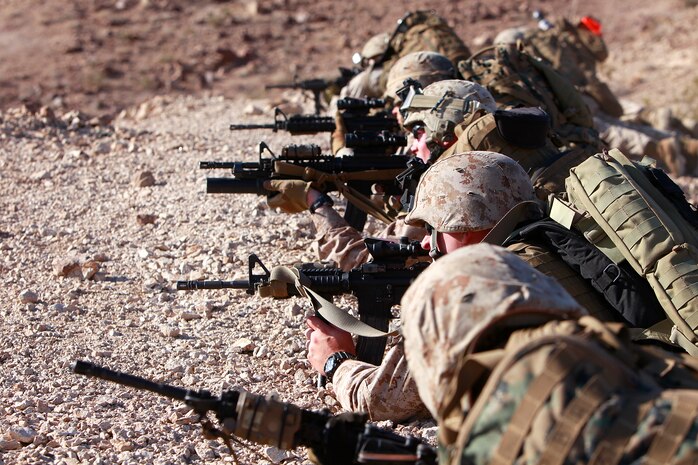 Marines with the Support by Fire Team, Tactical Recovery of Aircraft and Personnel Platoon, 15th Marine Expeditionary Unit, provide suppressive fire, in the Chocolate Mountains, Calif., May 11. The training scenario involved the platoon recovering personnel from a tactical air control party, after they reported contact from a notional local enemy attack force. The training was conducted to increase the competency of the TRAP force and as a part of the ground portion of Realistic Urban Training, which the 15th MEU is conducting in preparation for their deployment scheduled for this fall.