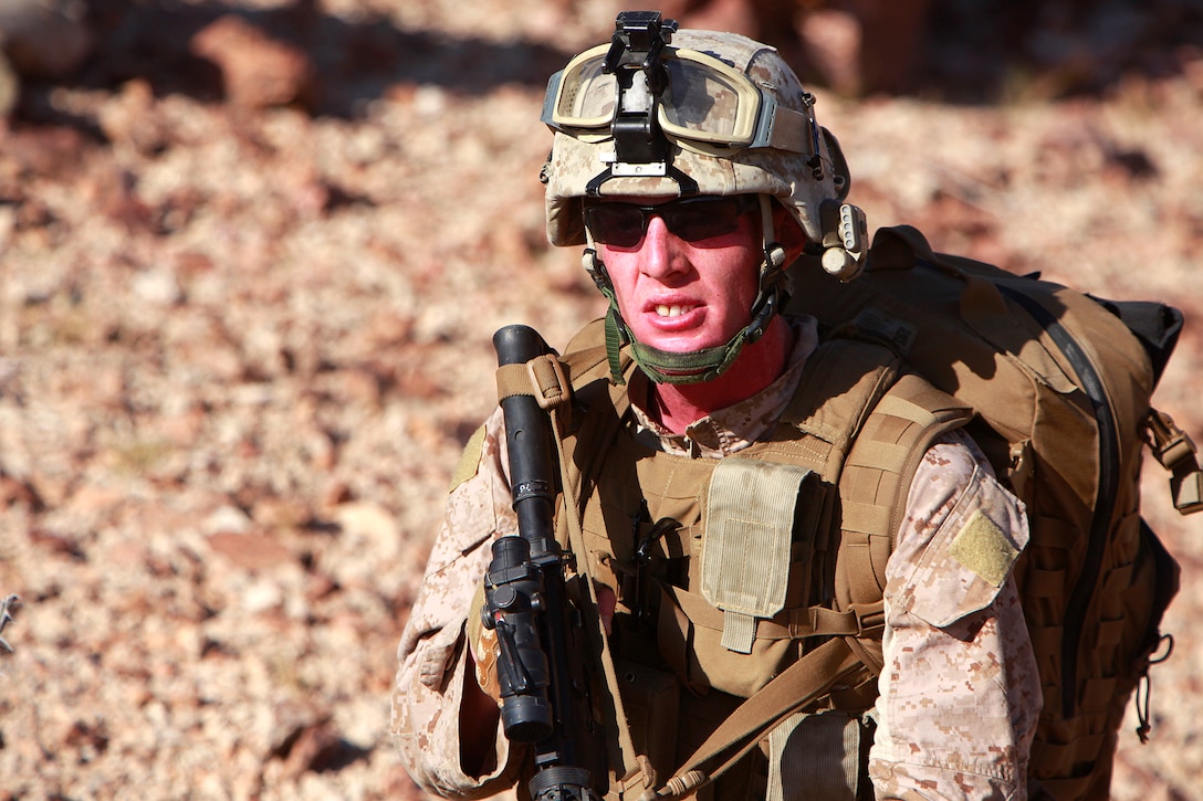 Sergeant Andrew E. Campbell, signals intelligence Marine, Recovery Element, Tactical Recovery of Aircraft and Personnel Platoon, 15th Marine Expeditionary Unit, waits for the rest of the Recovery Element to return to the rally point before leaving, in the Chocolate Mountains, Calif., May 11. The training scenario involved the platoon recovering personnel from a tactical air control party, after they reported contact from a notional local enemy attack force. The training was conducted to increase the competency of the TRAP force and as a part of the ground portion of Realistic Urban Training, which the 15th MEU is conducting in preparation for their deployment scheduled for this fall. Campbell, 24, is from Amarillo, Texas.