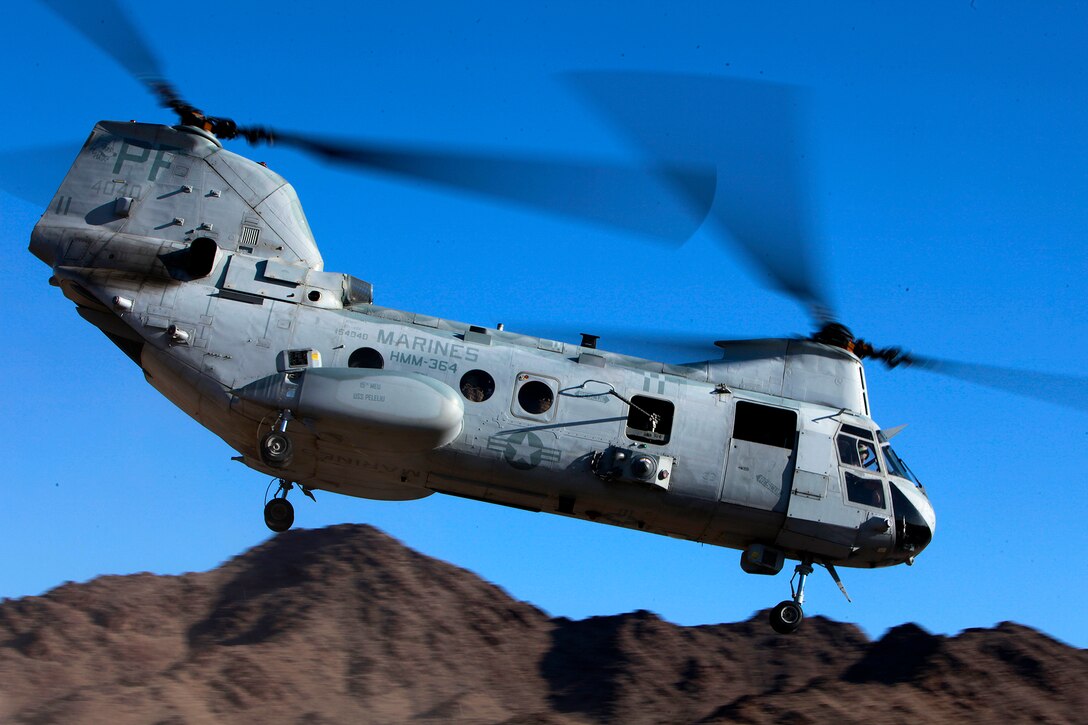 A CH-46 Sea Knight leaves here after the Tactical Recovery of Aircraft and Personnel platoon successfully completed a recovery mission of Marines with a tactical air control party, in the Chocolate Mountains, Calif., May 11. The training scenario involved the platoon recovering personnel from a tactical air control party, after they reported contact from a notional enemy attack force. The training was conducted to increase the competency of the TRAP force and as a part of the ground portion of Realistic Urban Training, which the 15th MEU is conducting in preparation for their deployment scheduled for this fall.