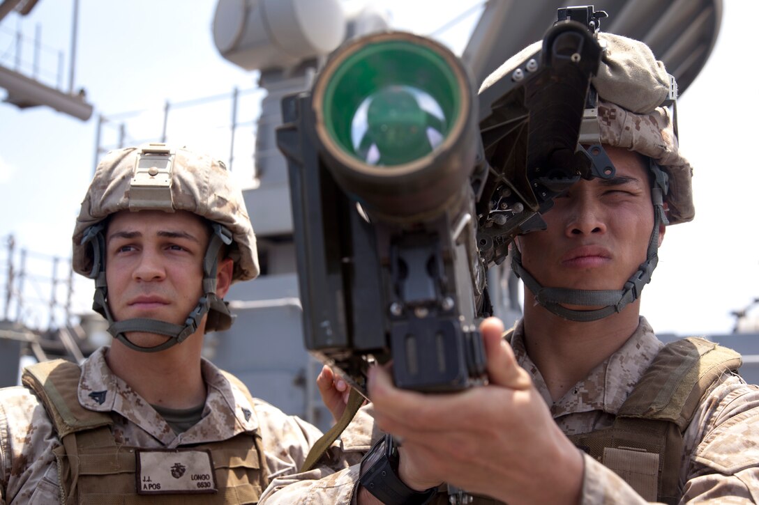 Cpls. Joseph E. Longo, right, and Joseph E. Sasamoto practice searching and scanning techniques with a surface-to-air missile launcher aboard USS Makin Island here May 11. Longo, 22, hails from Chino Hills, Calif. Sasamoto, 20, hails from San Jose, Calif. The Marines serve as low-altitude air-defense gunners with Marine Medium Helicopter Squadron 268 (Reinforced), the aviation combat element for the 11th Marine Expeditionary Unit. The unit embarked the ship, as well as USS New Orleans and USS Pearl Harbor in San Diego Nov. 14, beginning a seven-month deployment to the Western Pacific, Horn of Africa and Middle East regions.