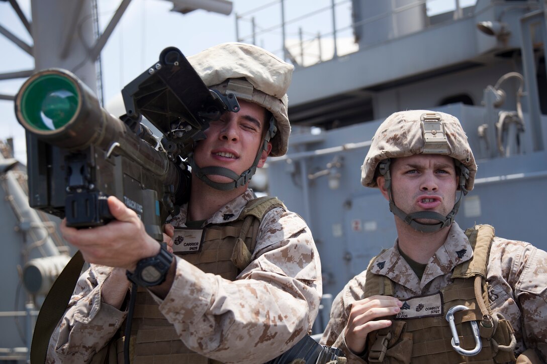 Cpls. Seth C. Carrier, right, and Daniel T. Conroy practice searching and scanning techniques with a surface-to-air missile launcher aboard USS Makin Island here May 11. Carrier, 23, hails from Springfield, Mass. Conroy, 21, hails from Boston. The Marines serve as low-altitude air-defense gunners with Marine Medium Helicopter Squadron 268 (Reinforced), the aviation combat element for the 11th Marine Expeditionary Unit. The unit embarked the ship, as well as USS New Orleans and USS Pearl Harbor in San Diego Nov. 14, beginning a seven-month deployment to the Western Pacific, Horn of Africa and Middle East regions.