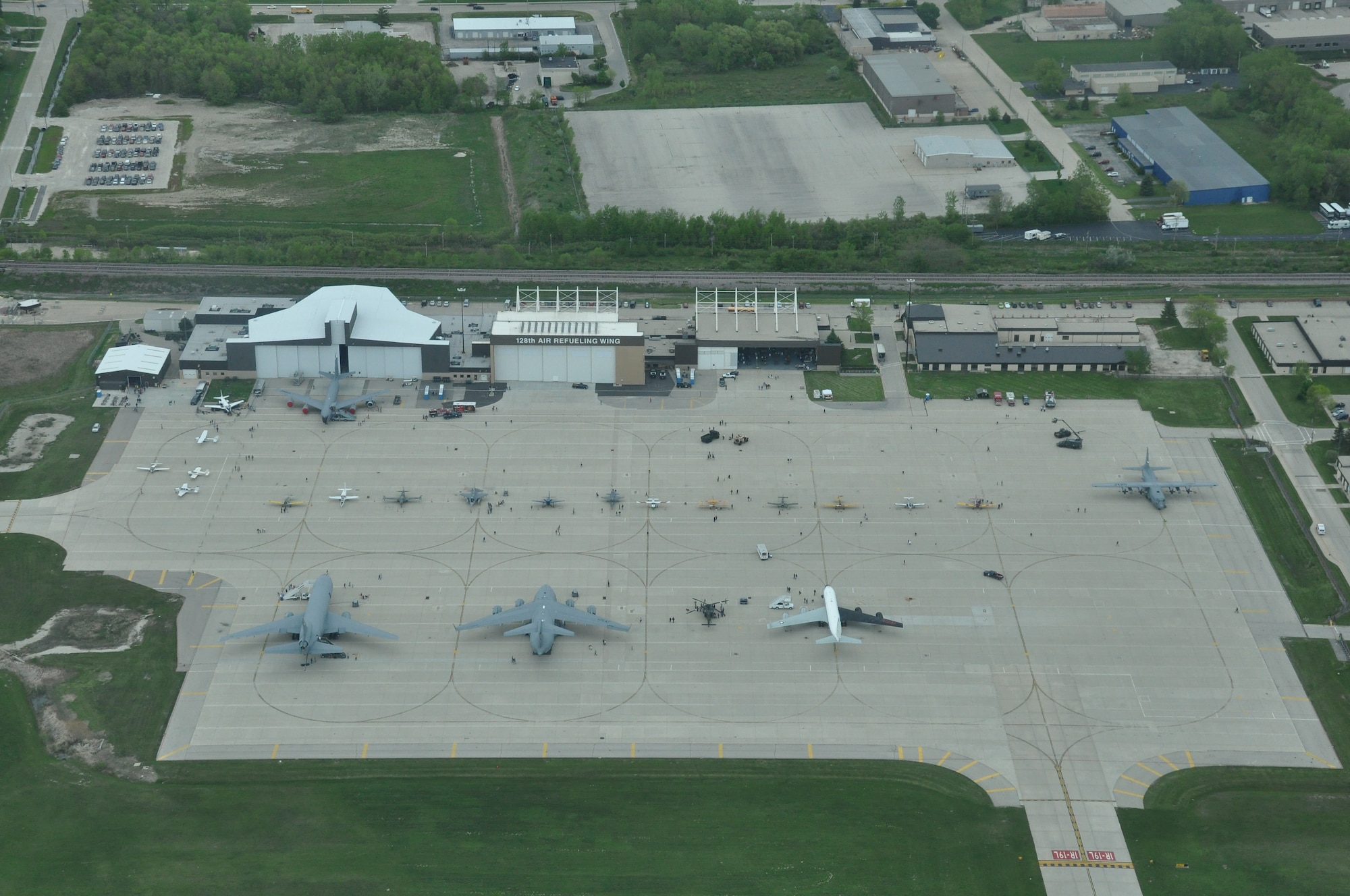 An aerial view of the 128th Air Refueling Wing, Milwaukee, as members of the general public are given the chance to tour military aircraft, talk with military personal, and look at stands set up inside of a hangar on 12 May, 2012. The military display ran from May 12th - May 13th as an opening event for the 2012 Armed Forces Week experience. U.S. Air Force photo by Staff Sgt. Jeremy Wilson 