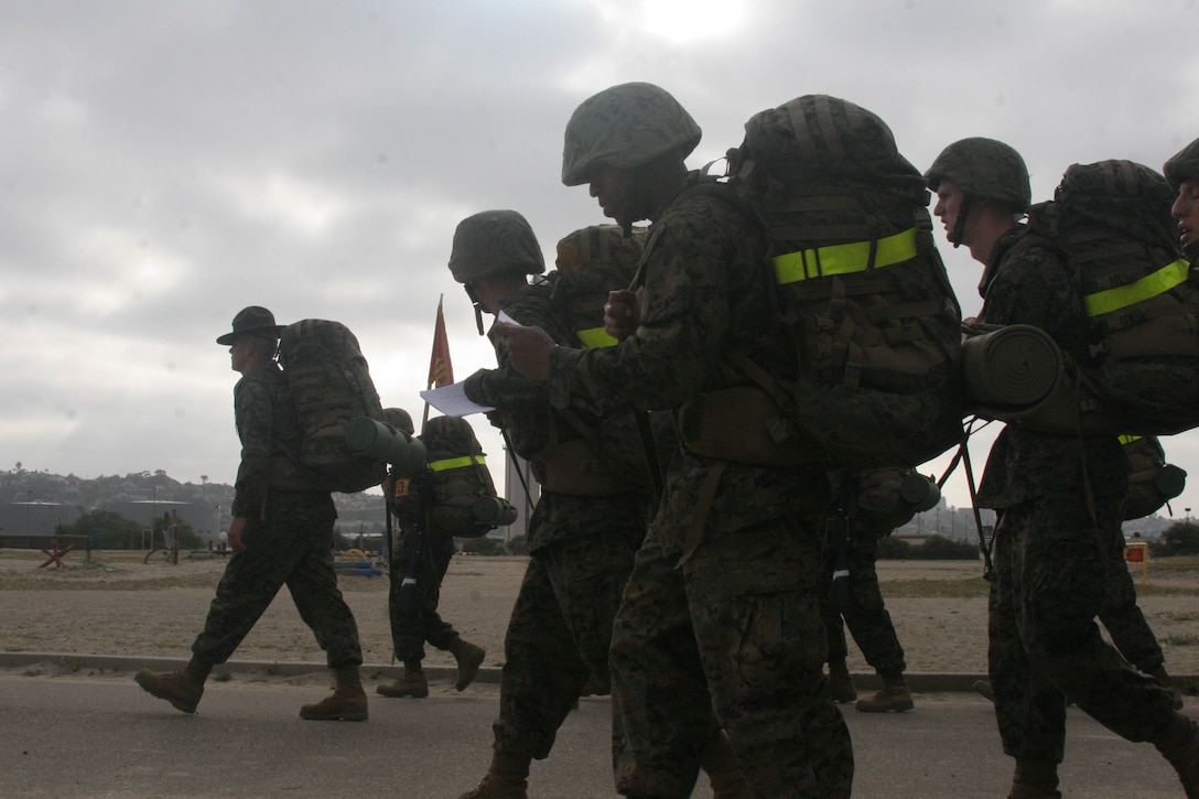 Recruits of Company E, 2nd Recruit Training Battalion, recite knowledge as they hike a sustainment hike, a six-mile hike around base, May 12 aboard Marine Corps Recruit Depot San Diego. Drill instructors use the hike to instill knowledge about Marine Corps history to help the recruits with their final exams. The hike is also used as a tool to prepare the recruits for the many miles they will travel during the Crucible, a 54-hour field-training exercise.